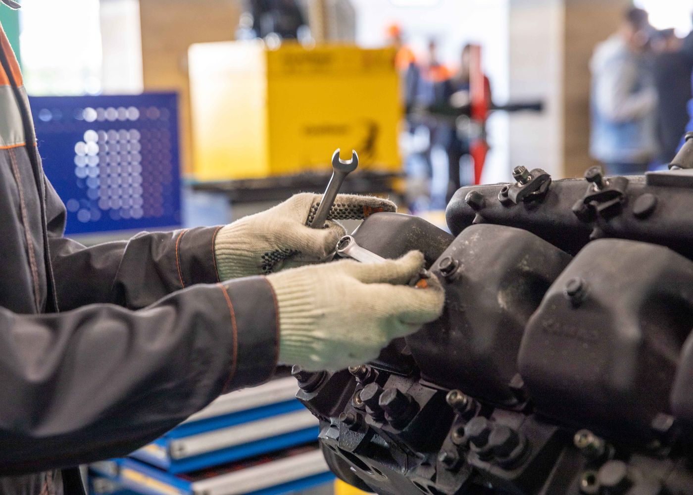 Refurbishment job card: hands-on engine work. Illustrative stock photo.