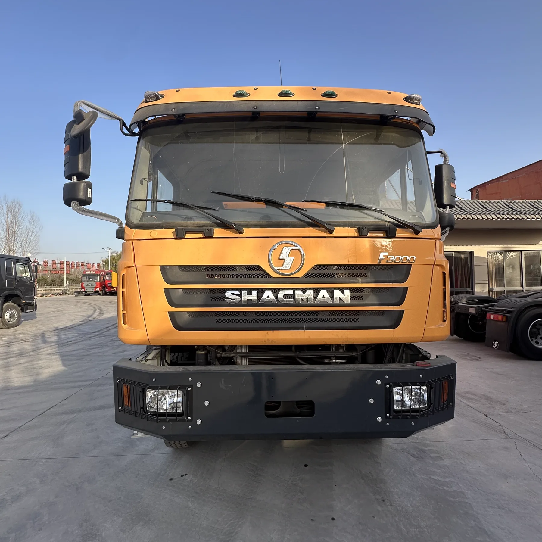 Yellow SHACMAN F3000 dump truck front view